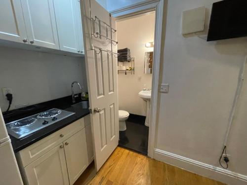 a small bathroom with a sink and a toilet at Nestel Nest 1 bedroom apartment in New York