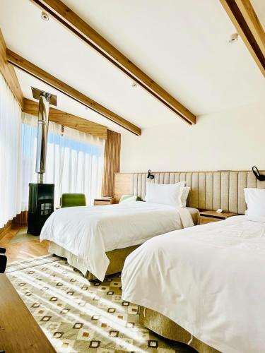 Postel nebo postele na pokoji v ubytování Butèle Resort