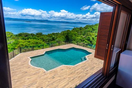 a view of a swimming pool from the balcony of a house at Mansão VOAR in Florianópolis