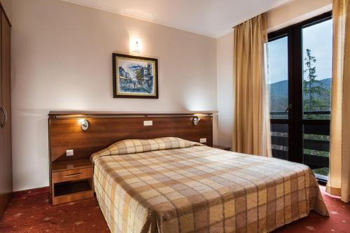 Katil atau katil-katil dalam bilik di Hotel Izvor