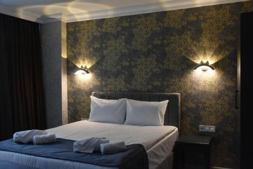 Ένα ή περισσότερα κρεβάτια σε δωμάτιο στο Palmera City Hotel