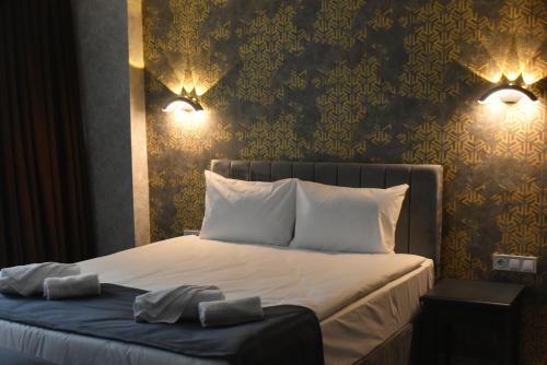 Ένα ή περισσότερα κρεβάτια σε δωμάτιο στο Palmera City Hotel