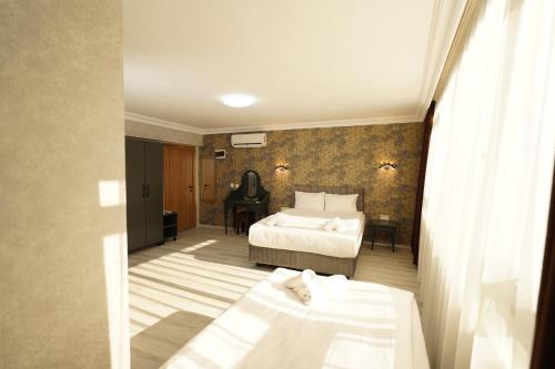 Ένα ή περισσότερα κρεβάτια σε δωμάτιο στο Palmera City Hotel