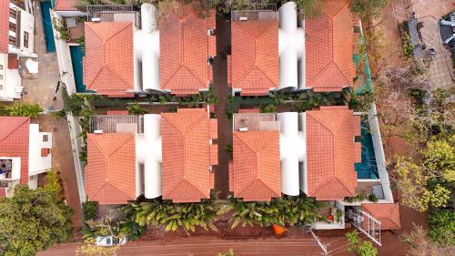an overhead view of a row of houses with orange roofs at ELIVAAS Bogenvilla Luxe 3 BHK Villa Near Ozran Beach in Assagao