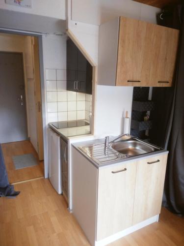 a small kitchen with a sink and a counter at Ski et montagne au Corbier ! in Villarembert