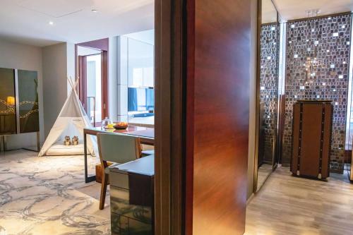 a living room with a desk and a table at Park Hyatt New York in New York