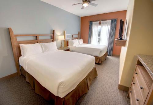 a hotel room with two beds and a window at Spirit Ridge, in The Unbound Collection by Hyatt in Osoyoos