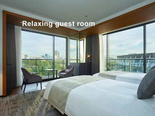 En eller flere senge i et værelse på Mitsui Garden Hotel Jingugaien Tokyo Premier