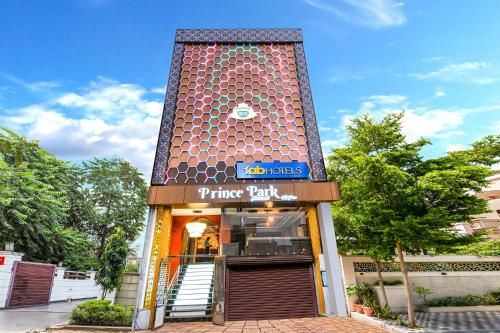 a entrance to a pizza shop with a building at FabHotel Prince Park - Nr Sajra Fort in Vellore