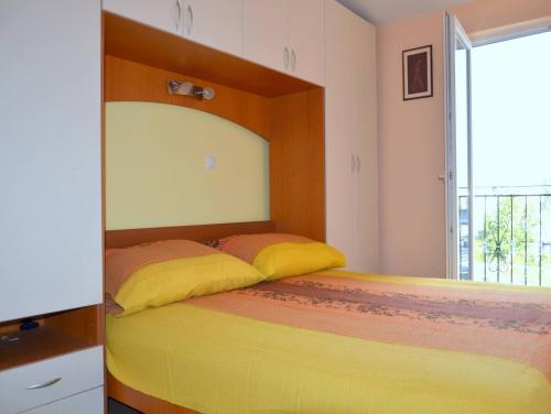 מיטה או מיטות בחדר ב-Apartman Julienne