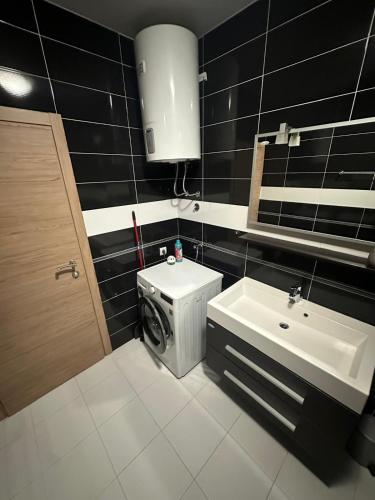 a bathroom with a toilet and a sink at Apartman Surya Medulin in Medulin