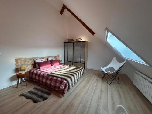 a bedroom with a large bed and a window at Loft Ô Faix in Ancelle