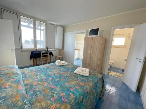 Ένα ή περισσότερα κρεβάτια σε δωμάτιο στο Acquaviva House