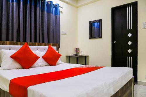 Ένα ή περισσότερα κρεβάτια σε δωμάτιο στο Hotel O Pritesh Inn