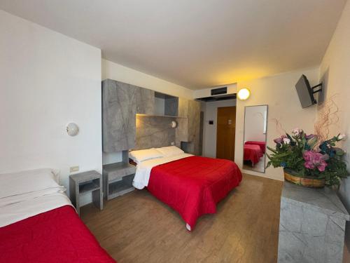 Кровать или кровати в номере Ciccio Family Hotel Polsa di Brentonico