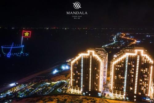 a view of a city at night with lights at Apec MANDALA CHAM BAY MUI NE SPA RESORT AND CONDOTEL in Ấp Thiẹn Ái