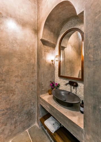 a bathroom with a sink and a mirror at Villa Lluvia 5bhk-Huge Pvt Pool-Caretaker-Bathtub-Big Garden-Genset Backup- Siolim in Oxel