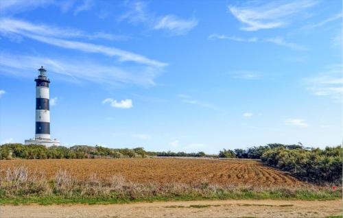 a lighthouse in the middle of a field at Gorgeous Home In Saint-Denis-D'oléron in Saint-Denis-dʼOléron
