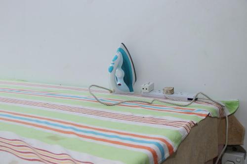 Una cama o camas en una habitación de Caritas Rest