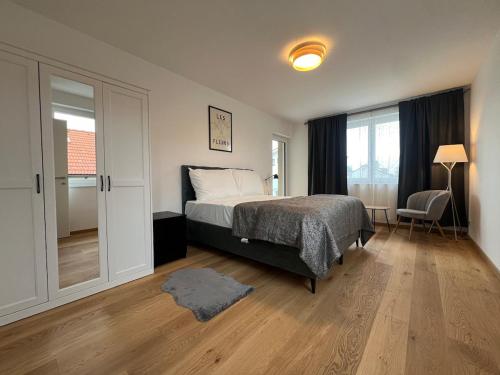 Posteľ alebo postele v izbe v ubytovaní Leopoldsdorf Premium Apartments