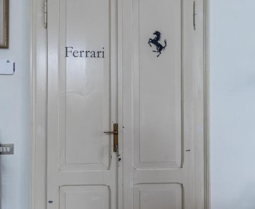 a white door with the word ferret on it at Room & Breakfast Canalino 21 in Modena