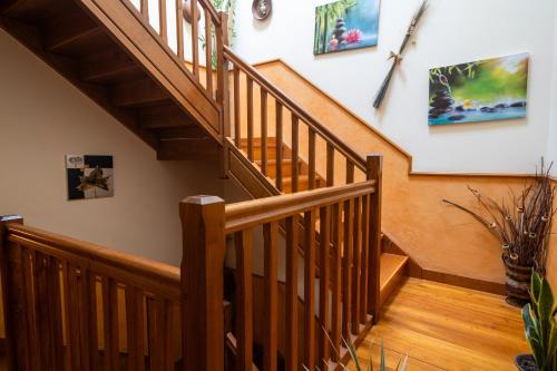 a staircase with wooden railings in a home at Matxingonea 1 in Urdax