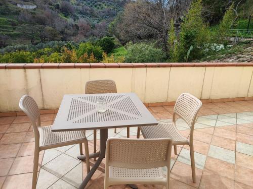 a white table and chairs on a patio at BBuSS Country Club in Catanzaro