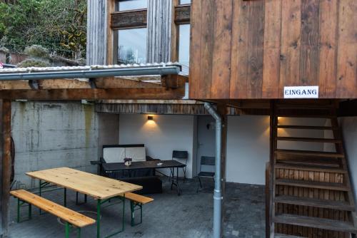 a building with a desk and a table and a desk at Sahlihuus Unterkunft in Köniz