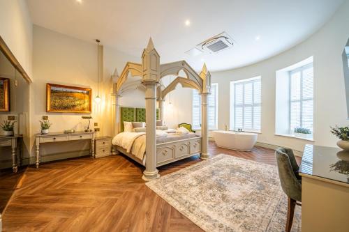 a bedroom with a bed and a tub and a sink at St Marys Quarters in Nottingham