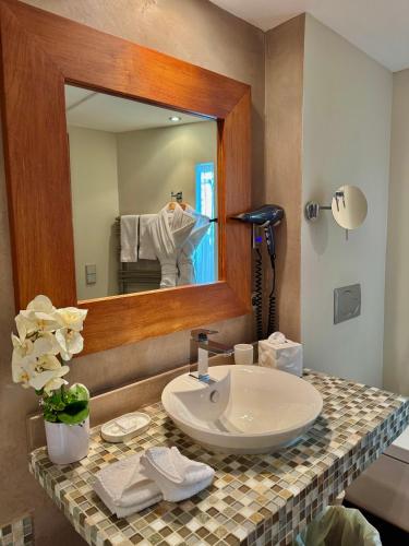 a bathroom with a sink and a mirror at Cannes Villa St Barth in Cannes