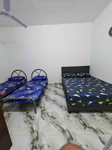 Homestay Banting #7, TUTUP SEMENTARAにあるベッド