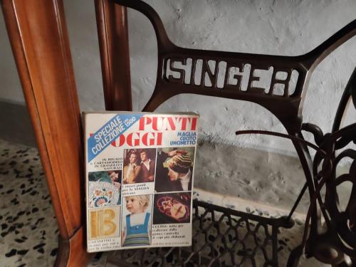 a magazine on the rack of a bike at Panoramic Suites - Casa degli Artisti in Citerna