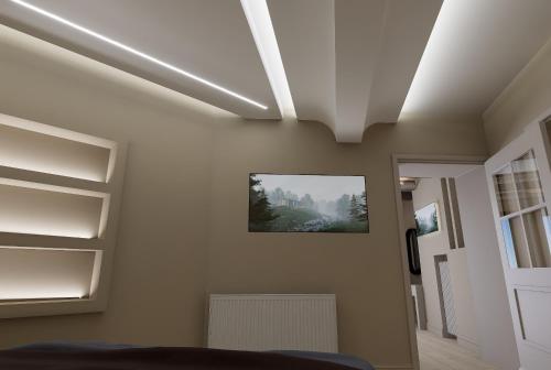 a bedroom with a white ceiling with shelves at Ktima Faki, Olympus Mountain Accommodation & Retreat in Litochoro