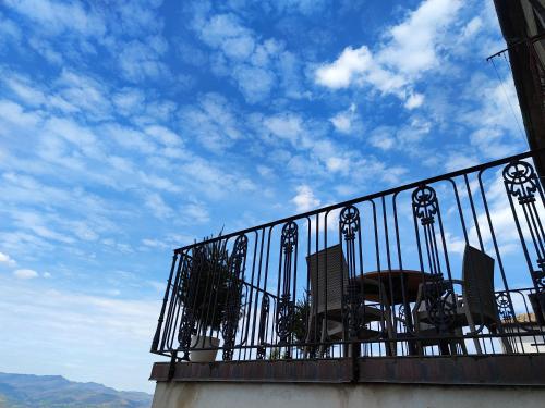 a balcony with a blue sky and some buildings at Panoramic Suites - Casa degli Artisti in Citerna