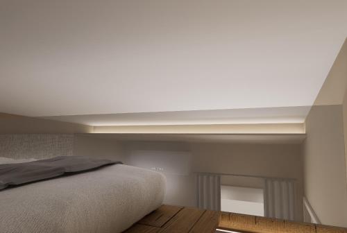 a bedroom with a bed and a white ceiling at Ktima Faki, Olympus Mountain Accommodation & Retreat in Litochoro