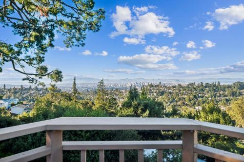 a view of the city from the balcony of a house at Charming 1933 Ridge-Top Home with Stunning Views home in Oakland