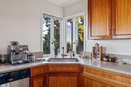 a kitchen with a sink and a window at Charming 1933 Ridge-Top Home with Stunning Views home in Oakland