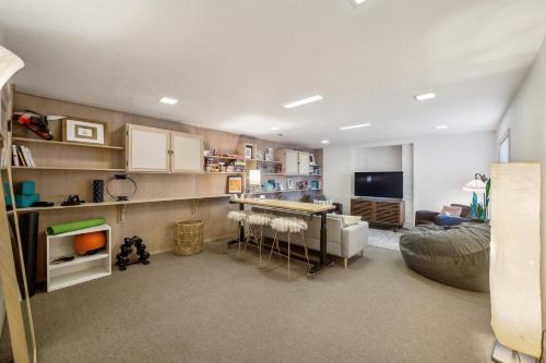 a living room with a couch and a table in a room at Charming 1933 Ridge-Top Home with Stunning Views home in Oakland