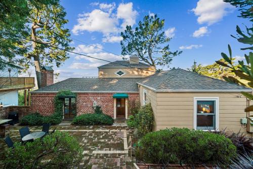 a home with a brick house at Charming 1933 Ridge-Top Home with Stunning Views home in Oakland
