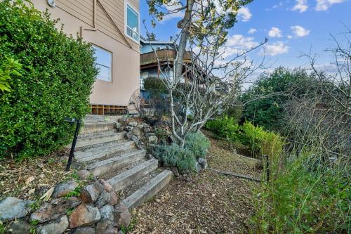 a house with a set of stairs in front of it at Charming 1933 Ridge-Top Home with Stunning Views home in Oakland