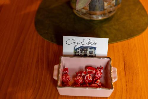 a small dish of cherries with a house on top at Matxingonea 2 in Urdax