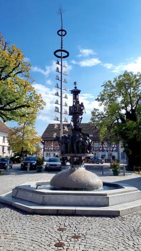 a fountain in the middle of a street at Mäsers Allgäuherz in Wiggensbach