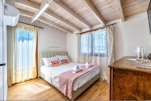 Postel nebo postele na pokoji v ubytování Guest House Aphrodite