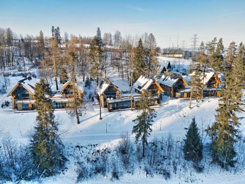 an aerial view of a lodge in the snow at Rezydencja Boutique SKI - 200m do Term Bania Odkryj Białkę in Białka Tatrzanska