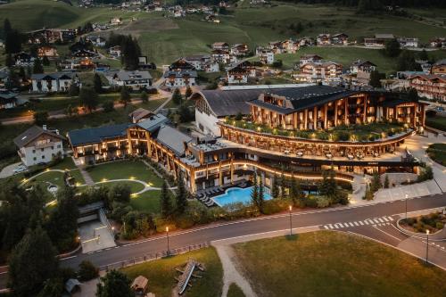 an aerial view of a large building with a street at Granbaita Dolomites in Selva di Val Gardena