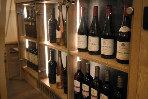 a bunch of bottles of wine are on shelves at Penzion U Nováků in Kožlí u Orlíka