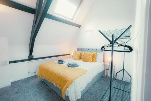 a bedroom with a bed and a window at Hidden Gem in Plymouth