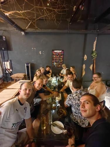 a group of people sitting at a table in a room at The Manor by Mingle - FREE Breakfast with Poolside Access in Kuala Lumpur