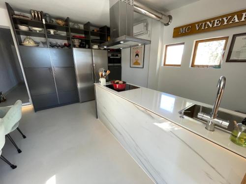 a kitchen with a sink and a counter top at Casa Rocas Private Pool with swimjet! in Comares