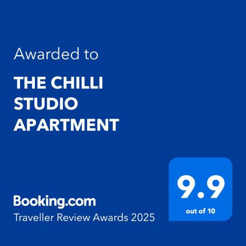 a blue sign with the text awarded to the chill studio apartment at THE CHILLI STUDIO APARTMENT in Unawatuna
